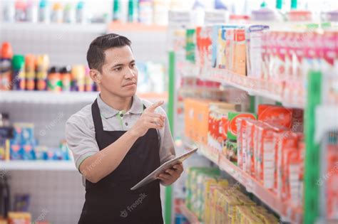 Premium Photo Male Shopkeeper Working In A Grocery Store