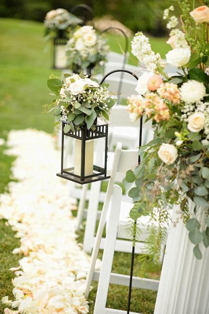 Lanterns With Greenery And Flowers Along The Aisle Wedding Lanterns