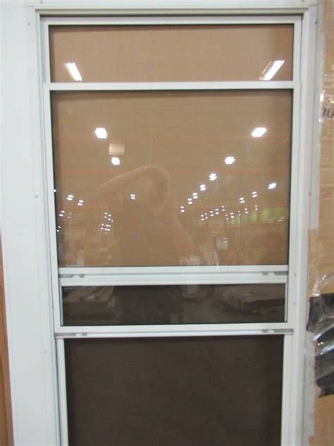 The storm door provides complete weather protection. LARSON West Point White Mid-View Tempered Glass Standard ...