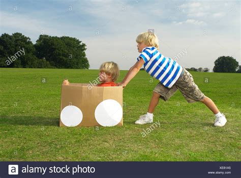 Two People Pushing Object High Resolution Stock Photography And Images