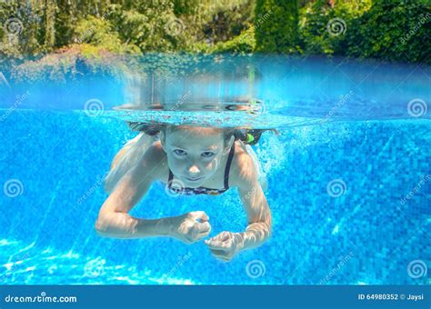 Child Swims In Pool Underwater Happy Active Girl Has Fun Under Water