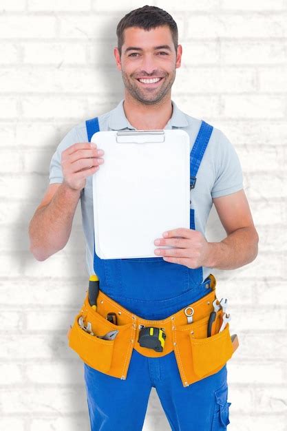 Premium Photo Composite Image Of Portrait Of Happy Repairman Showing