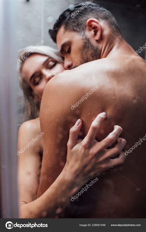 Selective Focus Passionate Naked Heterosexual Couple Hugging Kissing