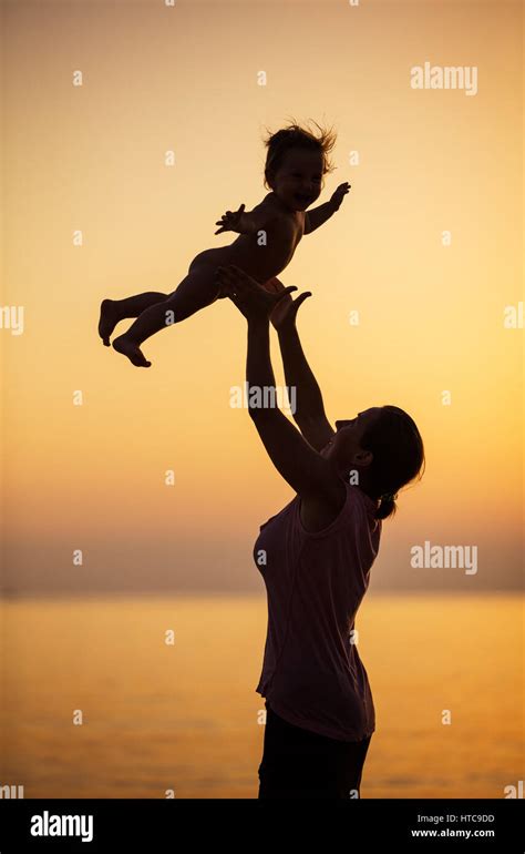 Mom Throwing Baby In Air Hi Res Stock Photography And Images Alamy