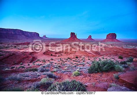 Image Of Desert Landscape Of Large Red Rocks And Blue Hue Canstock