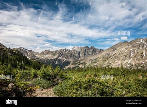 Rugged Mountain Ridgeline In The Distance On A Bright Sunny Day With