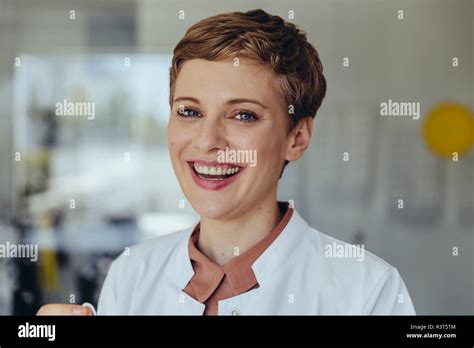 Portrait Of A Confident Female Doctor Laughing Stock Photo Alamy