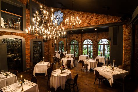 A long dining table set for a dinner party with a white. Most haunted places in NYC, from theaters to bars
