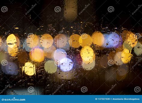 Rain Drops On Window With Road Light Bokeh Stock Photo Image Of Blue
