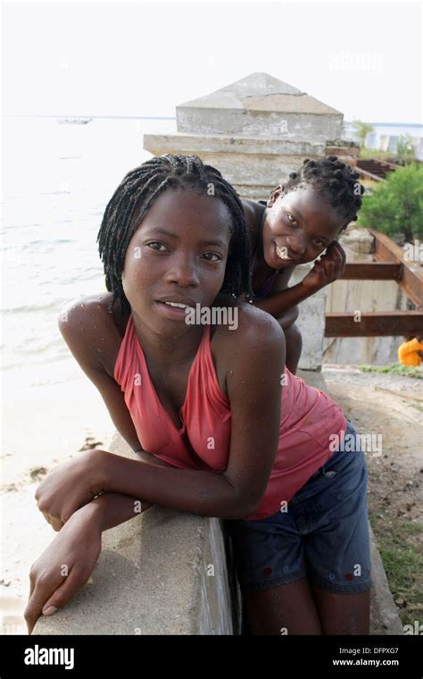 Two Young Naughty African Girls Looking Curiously Into The Camera Stock