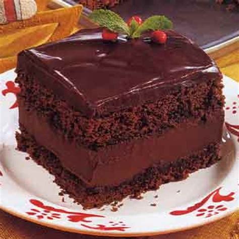 In a medium bowl, beat mascarpone and powdered sugar until smooth and spread the chocolate frosting on the top and sides of the cake using an offset spatula. Mocha Layer Cake with Chocolate-Rum Cream Filling recipe | Epicurious.com