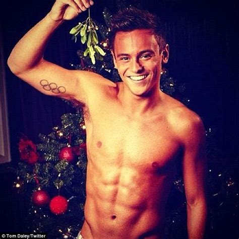 topless tom daley entices fans with a naughty and nice twitter snap as he dangles a branch of