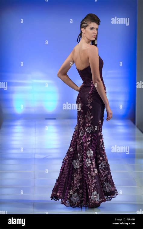 Model In Full Length Gown Poses On Runway During New York Fashion Week