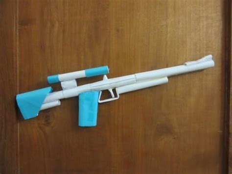 Roll it landscape and tape it up. How to Make a Paper Sniper Rifle that shoots Rubber Band ...