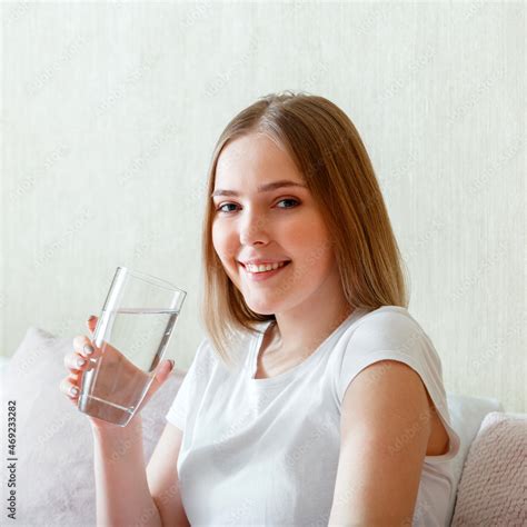 Smile Young Woman Drinks Glass Of Pure Water In Morning After Waking Up