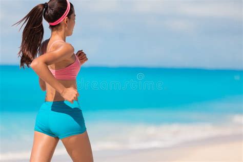 Running Sport Athlete Girl With Toned Body And Glutes Training On Beach Cardio Workout Fitness