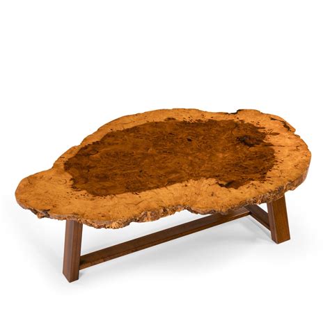 The glossy tables or glass styles are a beautiful way to add a modern twist to the traditional tables. A stylish polished coffee table - Wick Antiques