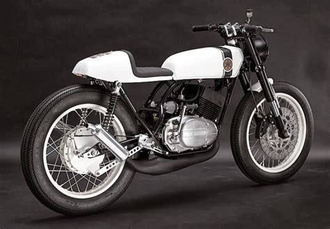 The definition of a cafe racer is a modified lightweight street machine that is used to sport around from cafe to café. MotoGp: Yamaha RD 250 Cafè Racer by Patrick Sauter