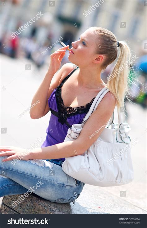 Woman Smoking Cigarette On Street Stock Photo 57870514