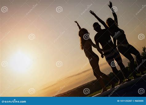 Group Of Happy Young People Enjoying Summer Sunset Stock Image Image