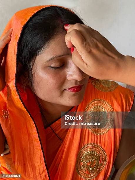 Closeup Image Of Indian Hindu Woman Wearing Sari Traditional Clothing Being Anointed With