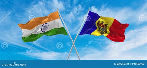 Crossed National Flags Of India And Moldova Flag Waving In The Wind At