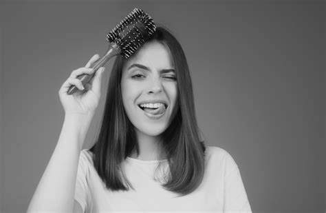 Premium Photo Funny Crazy Woman Combing Hair Portrait Of Female Model