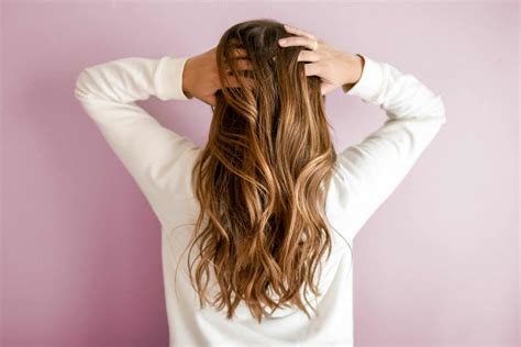 How Often Should You Wash Your Hair A Dermatologist Weighs In Brightly