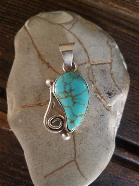 Beautiful Turquoise Sterling Silver Pendant With Swirl Accent