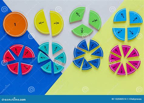 Colorful Math Fractions On Wooden Background Or Table Geometry And