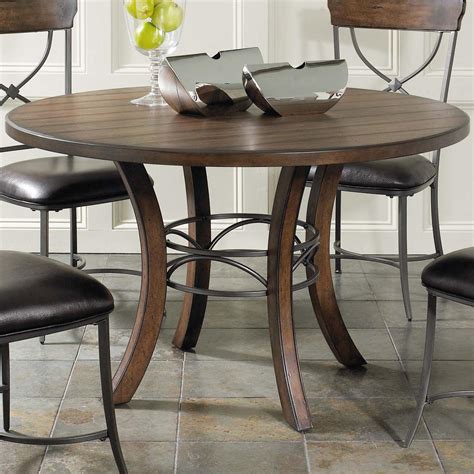 Round Wood Dining Table With Metal Acent Base By Hillsdale Wolf And