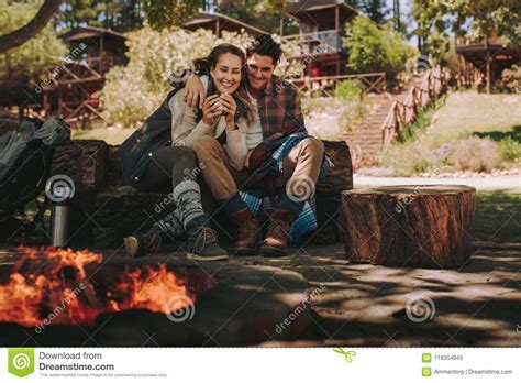 Loving Couple Resting By A Bonfire At Campsite Stock Image Image Of Happy Campfire 118354945
