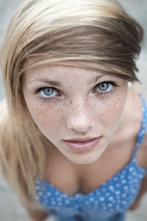 Cute Freckled Blond Girl With Green Blue Eyes Looking Right Up At You