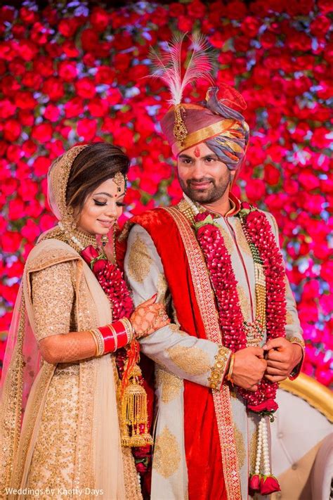 Majestic Indian Bride And Groom On Their Wedding Ceremonial Outfits Indian Bride And Groom