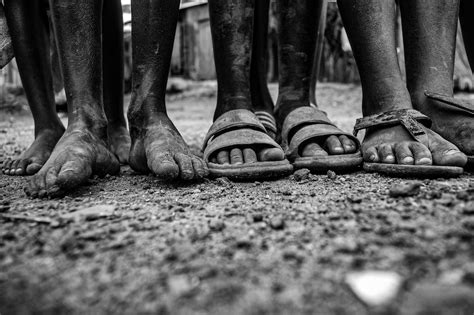 Black And White Photo Of Bare Feet And Dust · Free Stock Photo