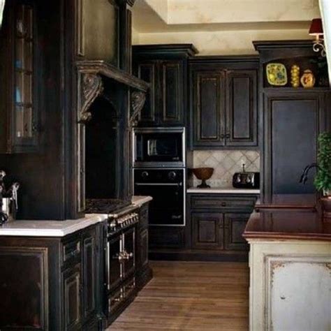 Before you begin to distress your kitchen cabinets, you need to remove any paint that is currently on them. distresed dark brown cabinets | Black kitchen cabinets ...