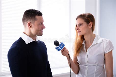 News Reporter Asking Question To Businessman Stock Photo Image Of