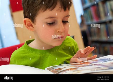 Child Reading At Public Library Stock Photo Alamy