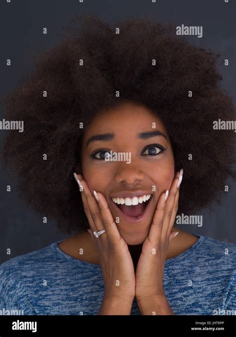 Portrait Of A Beautiful Friendly African American Woman With A Curly Afro Hairstyle And Lovely