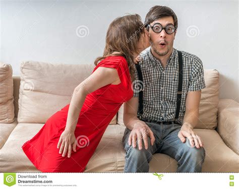 Shy Man Is Surprised By Kiss From Woman Sitting On Sofa Dating Concept Stock Image Image Of