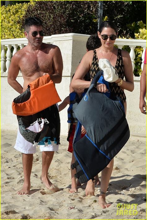 simon cowell bares fit physique on the beach with girlfriend lauren silverman in barbados