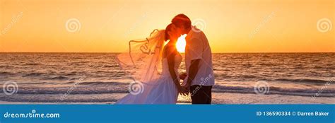 Bride And Groom Married Couple Sunset Beach Wedding Panorama Stock