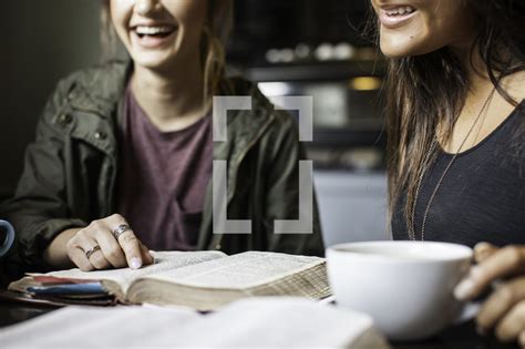 Two Girls Having A Bible Study At Coffee Shop — Photo — Lightstock