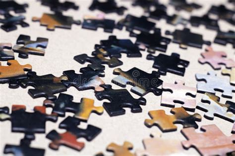 Puzzle Pieces Are Scattered On The Table Many Black Puzzle Pieces