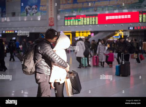 A Couple Of Chinese Lovers Kiss Each Other To Bid Farewell At The