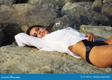 Beautiful Woman Laying On The Beach Rocks Stock Image Image Of Jumeirah Bikini