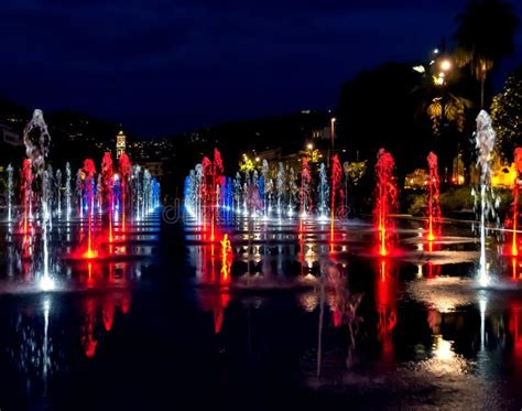 Night Shot Of Colorfully Lit Water Fountains On The Promenade Du