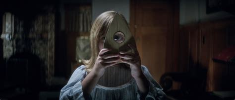 After finding a vintage spirit board in their parents' basement, a group of teens conjure an undead relative, who stalks them from beyond the grave. Ouija 2 Origin of Evil Movie trailer : Teaser Trailer