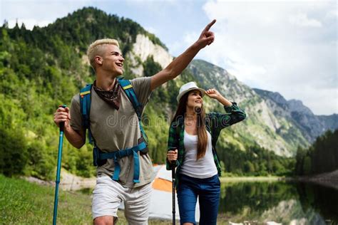 adventure travel tourism hike and people concept group of happy friends with backpack