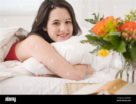 Portrait Of Woman Laying In Bed Stock Photo Alamy